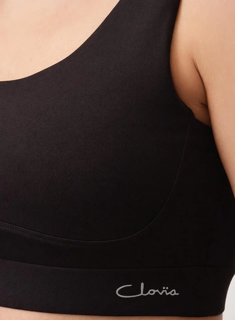 Clovia Black Medium Impact Sports Bra in Black with Removable Cups for Women | Best Price UAE